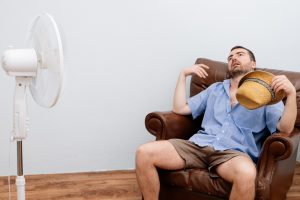 man-on-couch-with-fan