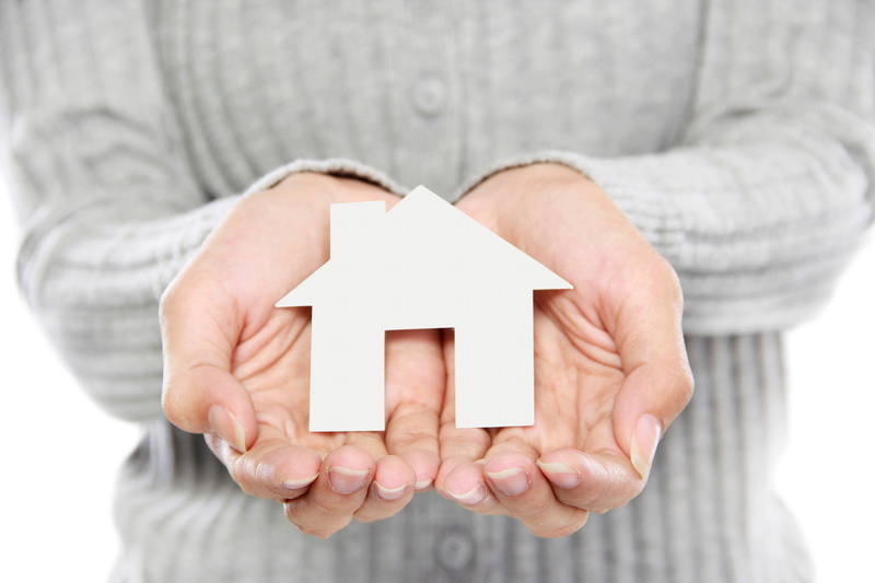 portrait-of-woman-holding-house-in-hands