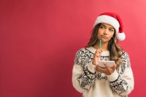 woman-wearing-santa-hat-thinking