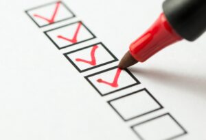 red-pen-checking-boxes-on-checklist