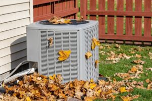 leaves-covering-ac-outdoor-condenser-unit