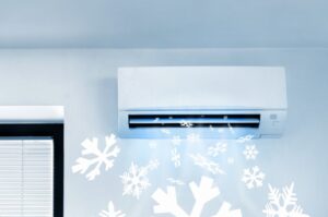ductless-mini-split-blowing-cold-air-illustrated-by-snowflakes